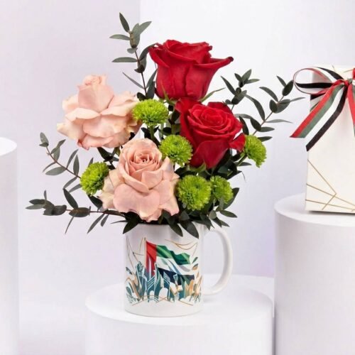 Emirati Womens Day Rose Mug Arrangement with Cappuccino & Red Roses by Warda Petals