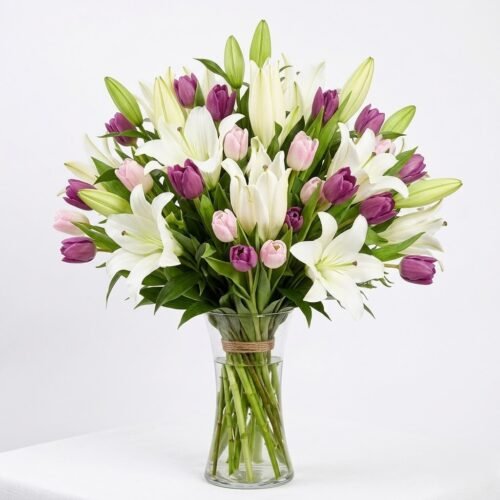 Medley Of Lilies and Tulips in Glass Vase