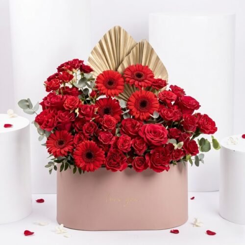 Timeless Blooms Flower Arrangement – Red Roses, Gerberas & Carnations in Oval Box by Warda Petals